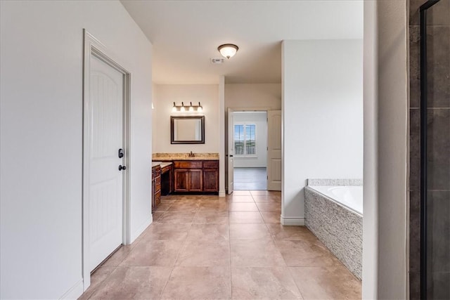 6241 Lago Vista Dr, Corpus Christi, TX 78414 - bathroom with vanity, a garden tub, tile patterned flooring, and a shower with door