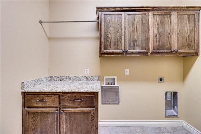 6241 Lago Vista Dr, Corpus Christi, TX 78414 - laundry area with cabinet space, hookup for an electric dryer, and hookup for a washing machine