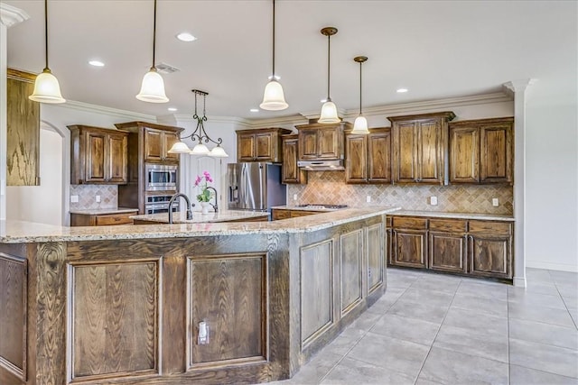 6241 Lago Vista Dr, Corpus Christi, TX 78414 - kitchen featuring appliances with stainless steel finishes, backsplash, a spacious island, crown molding, and light stone counters