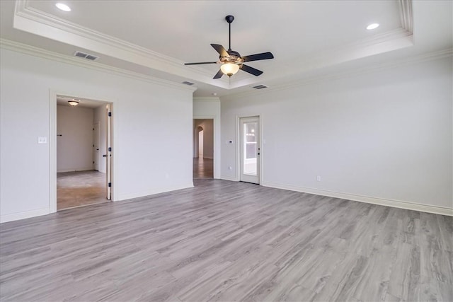 6241 Lago Vista Dr, Corpus Christi, TX 78414 - empty room with a raised ceiling, crown molding, ceiling fan, light wood-type flooring, and recessed lighting