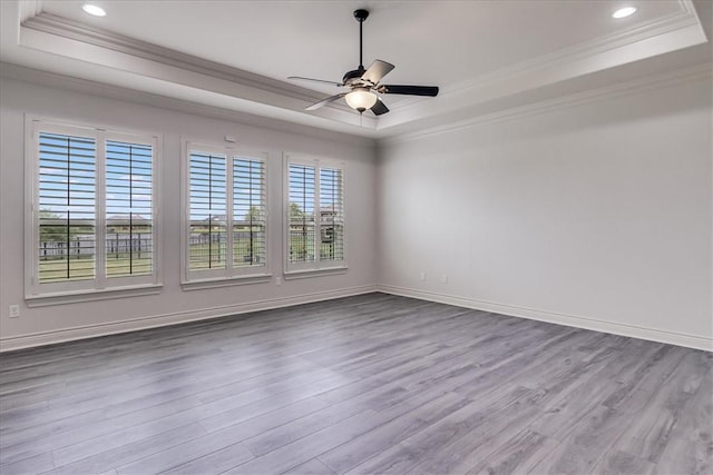 6241 Lago Vista Dr, Corpus Christi, TX 78414 - empty room with a raised ceiling, crown molding, wood finished floors, a ceiling fan, and recessed lighting