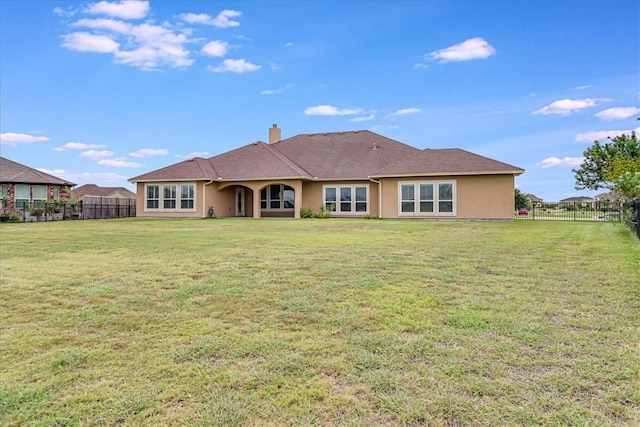 6241 Lago Vista Dr, Corpus Christi, TX 78414 - rear view of property featuring stucco siding and a chimney