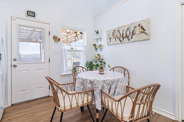 dining space with light wood finished floors