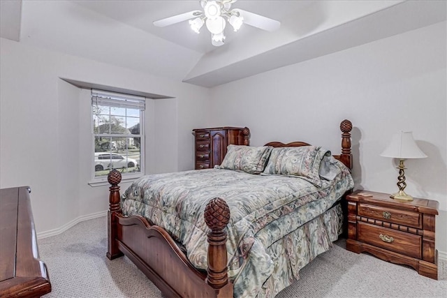 carpeted bedroom featuring ceiling fan and lofted ceiling