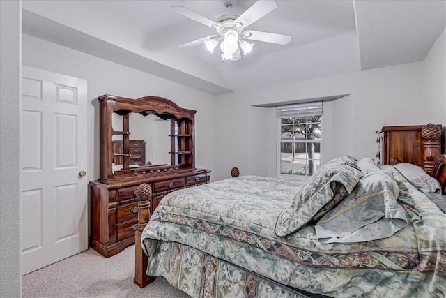 bedroom featuring ceiling fan, light colored carpet, and lofted ceiling