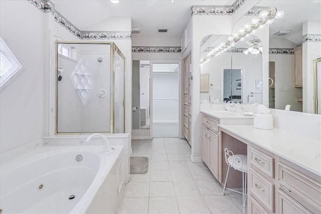 bathroom with vanity, tile patterned floors, and shower with separate bathtub