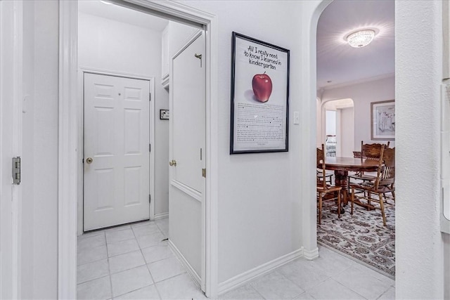 corridor featuring light tile patterned floors