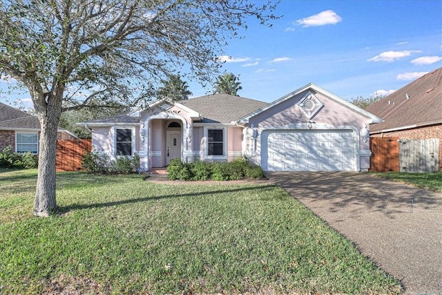 single story home featuring a garage and a front lawn