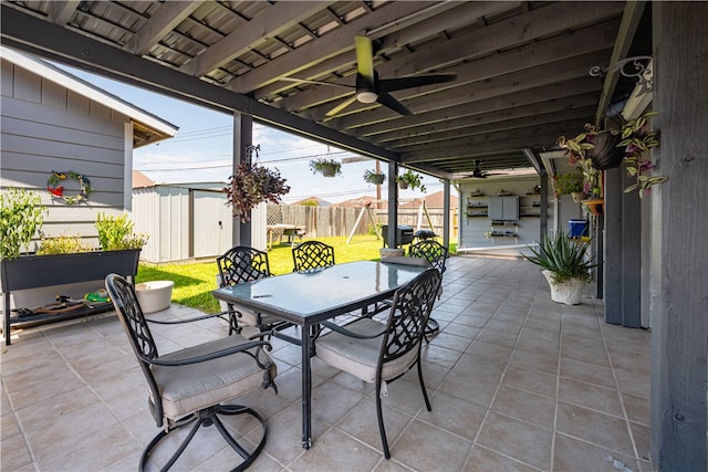 view of patio / terrace featuring a storage unit and ceiling fan