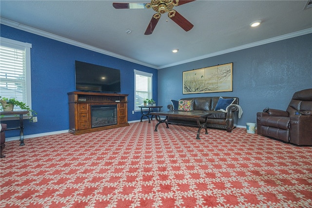 living room with carpet flooring, ceiling fan, and crown molding