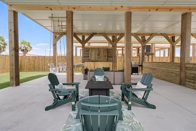 1911 Eskridge Rd, Port Aransas, TX 78373 - fenced backyard with a fire pit and a patio
