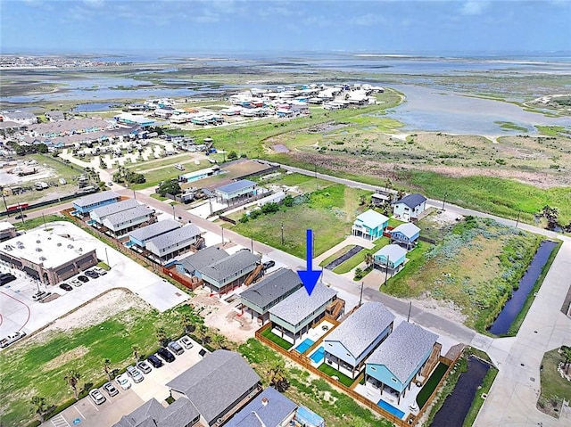 1911 Eskridge Rd, Port Aransas, TX 78373 - aerial perspective of suburban area featuring a large body of water