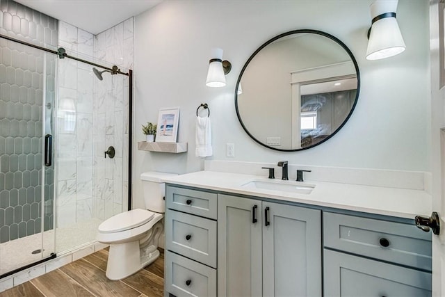 1911 Eskridge Rd, Port Aransas, TX 78373 - bathroom with vanity, a stall shower, and wood finished floors