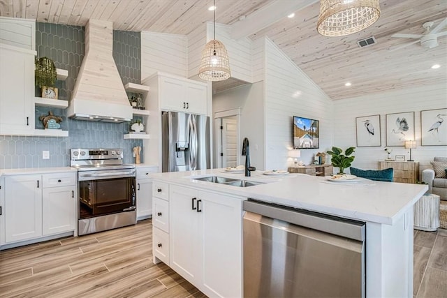 1911 Eskridge Rd, Port Aransas, TX 78373 - kitchen with appliances with stainless steel finishes, open shelves, custom range hood, open floor plan, and a wooden ceiling with exposed beams