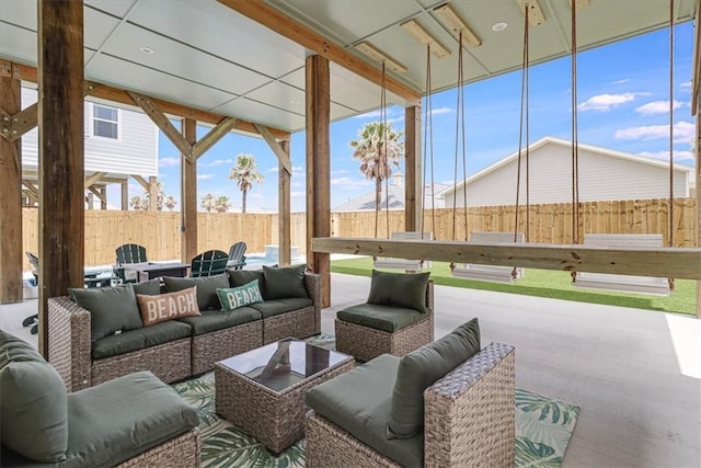 1911 Eskridge Rd, Port Aransas, TX 78373 - fenced backyard with an outdoor hangout area and a patio area