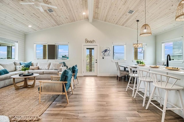 1911 Eskridge Rd, Port Aransas, TX 78373 - living room featuring wood finished floors, healthy amount of natural light, a ceiling fan, a wooden ceiling with exposed beams, and recessed lighting