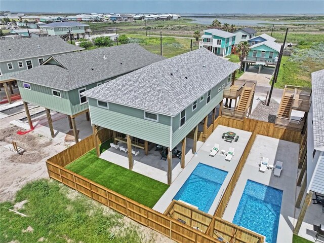 1911 Eskridge Rd, Port Aransas, TX 78373 - aerial view of residential area with a pool