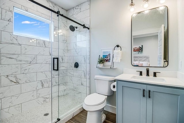 1911 Eskridge Rd, Port Aransas, TX 78373 - full bathroom featuring vanity, a shower stall, and wood finished floors