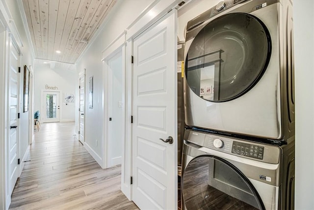 1911 Eskridge Rd, Port Aransas, TX 78373 - washroom featuring stacked washer and clothes dryer, light wood-style floors, wood ceiling, and recessed lighting