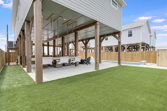 1911 Eskridge Rd, Port Aransas, TX 78373 - fenced backyard with a patio area