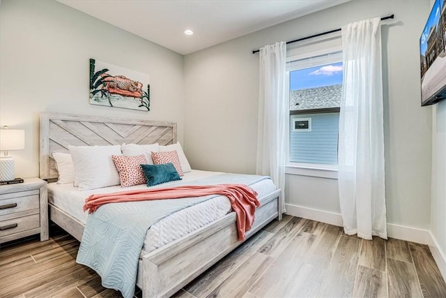 1911 Eskridge Rd, Port Aransas, TX 78373 - bedroom with wood finished floors and recessed lighting