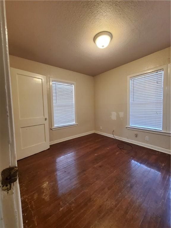 2838 Willard St, Corpus Christi, TX 78404 - spare room featuring dark wood-type flooring and a textured ceiling