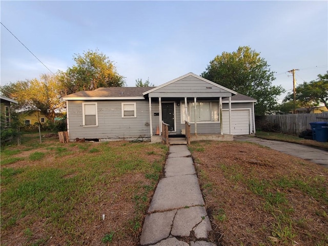2838 Willard St, Corpus Christi, TX 78404 - bungalow featuring a garage, concrete driveway, and covered porch