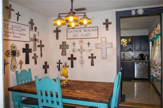 405 W Walton St, Beeville, TX 78102 - dining space with bar and a chandelier