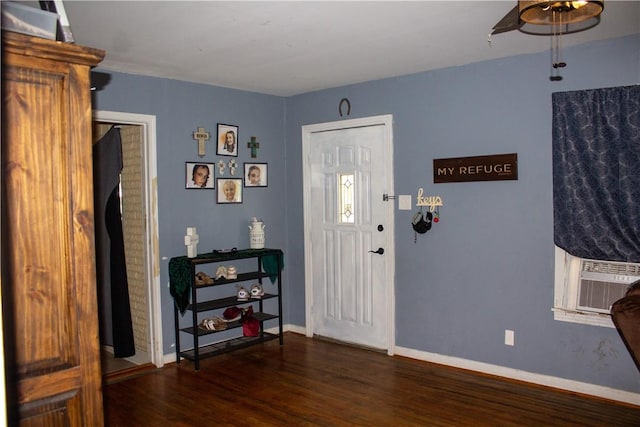 405 W Walton St, Beeville, TX 78102 - entrance foyer featuring wood finished floors, ceiling fan, and cooling unit