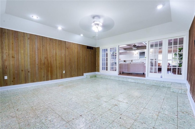 253 Melrose, Corpus Christi, TX 78404 - unfurnished living room featuring a ceiling fan, wood walls, tile patterned floors, and recessed lighting