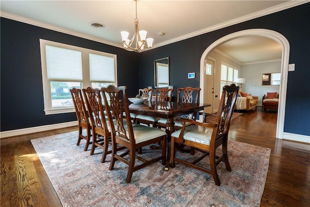 253 Melrose, Corpus Christi, TX 78404 - dining space featuring a chandelier, arched walkways, wood finished floors, and ornamental molding