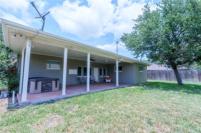 253 Melrose, Corpus Christi, TX 78404 - back of house featuring brick siding, a patio area, ceiling fan, and a hot tub