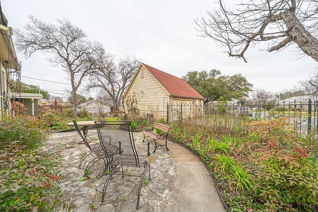 view of patio / terrace featuring fence