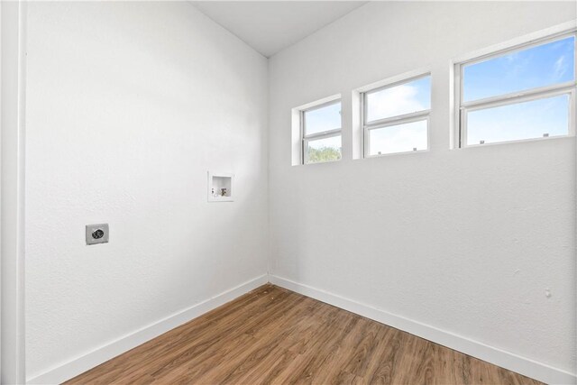1601 Cambridge Dr, Corpus Christi, TX 78415 - laundry room featuring hookup for an electric dryer, hookup for a washing machine, and wood finished floors