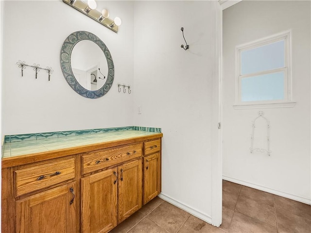 bathroom featuring tile patterned floors and vanity