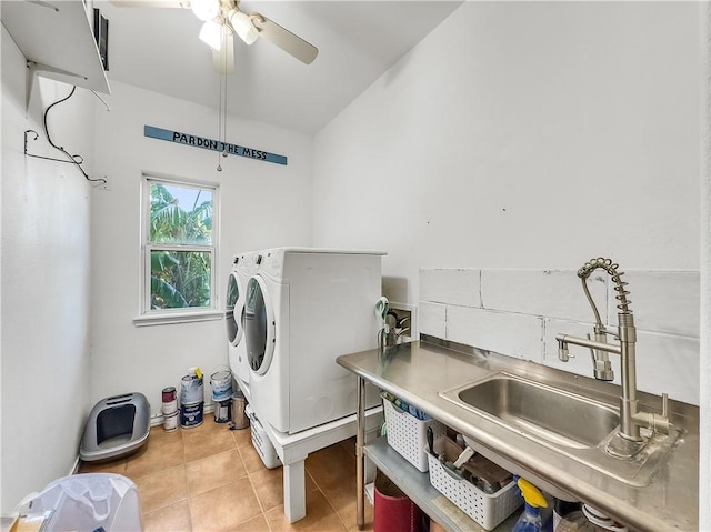 washroom featuring sink, washer and clothes dryer, ceiling fan, and light tile patterned flooring