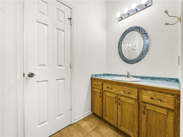 bathroom with tile patterned flooring and vanity