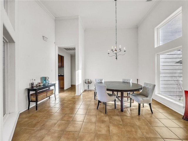 dining space with an inviting chandelier, light tile patterned floors, ornamental molding, and a high ceiling