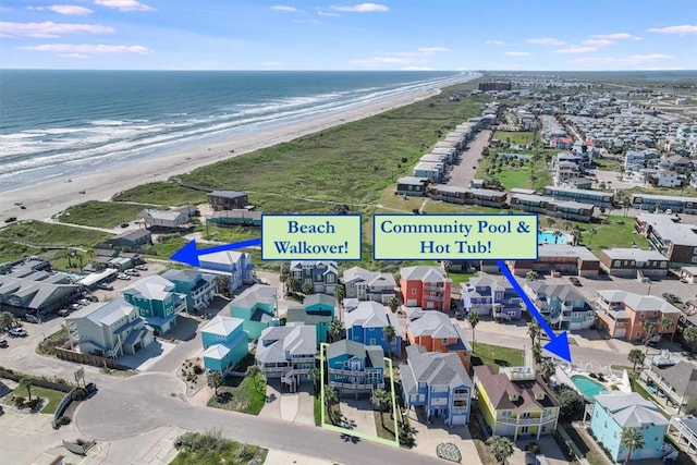 bird's eye view featuring a view of the beach and a water view