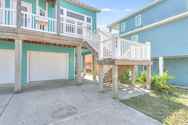 exterior space with a garage and a wooden deck