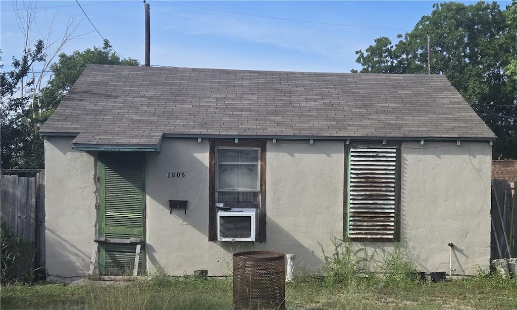2806 Kitchens St, Corpus Christi, TX 78405 - view of front of property with stucco siding, roof with shingles, central AC unit, and cooling unit