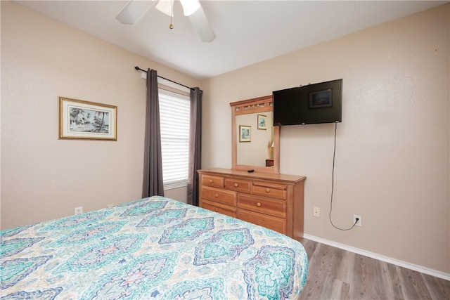 bedroom featuring ceiling fan and light hardwood / wood-style flooring