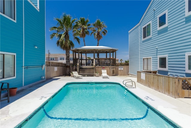 view of pool with a patio area and a gazebo