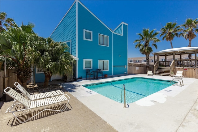 view of pool featuring a gazebo and a patio area