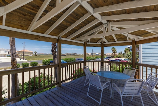 wooden terrace featuring a gazebo