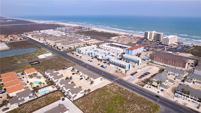 bird's eye view featuring a view of the beach and a water view