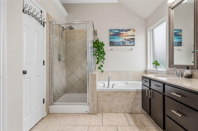 bathroom with vanity, lofted ceiling, tile patterned floors, and separate shower and tub