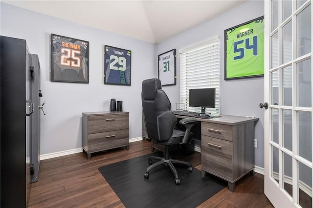 home office with dark wood-type flooring and vaulted ceiling