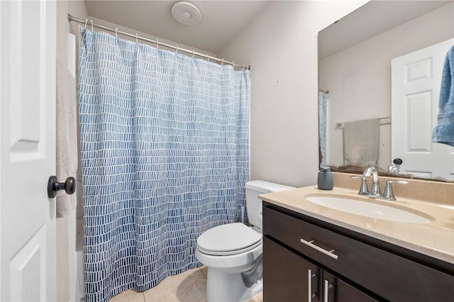 bathroom featuring a shower with shower curtain, vanity, toilet, and tile patterned flooring