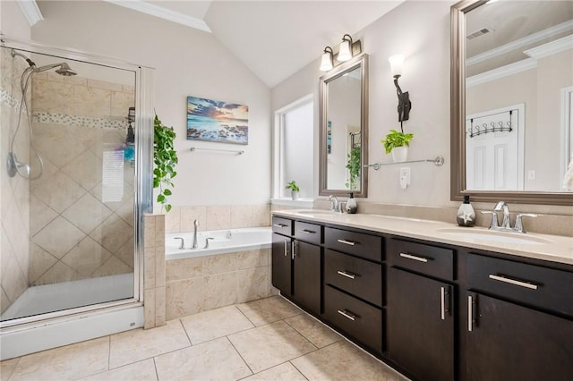 bathroom with lofted ceiling, separate shower and tub, ornamental molding, vanity, and tile patterned flooring